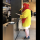 Illustration for article titled Can someone please get this singing chicken-rights protestor some chicken pants?em/em